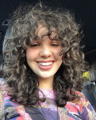 Cecilia Marti Chasman  wearing mixed color cloth.